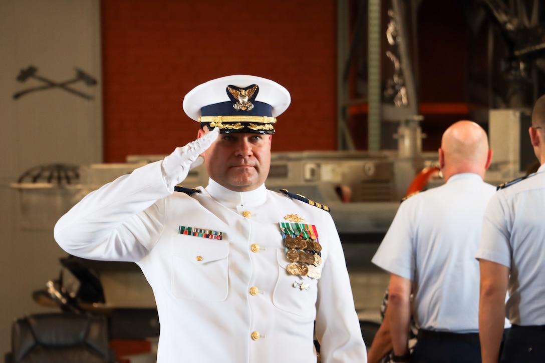 Cmdr. Kristopher J. Nolan, U.S. Coast Guard Port Security Unit 309’s commanding officer, salutes service members as he departs the unit's change of command ceremony in Port Clinton, Ohio, Sept. 21, 2024. Nolan assumed command during the ceremony and was previously assigned as the senior reserve officer at Coast Guard Sector Lake Michigan. (U.S. Coast Guard photo by Petty Officer 2nd Class Joshua Sanchez)