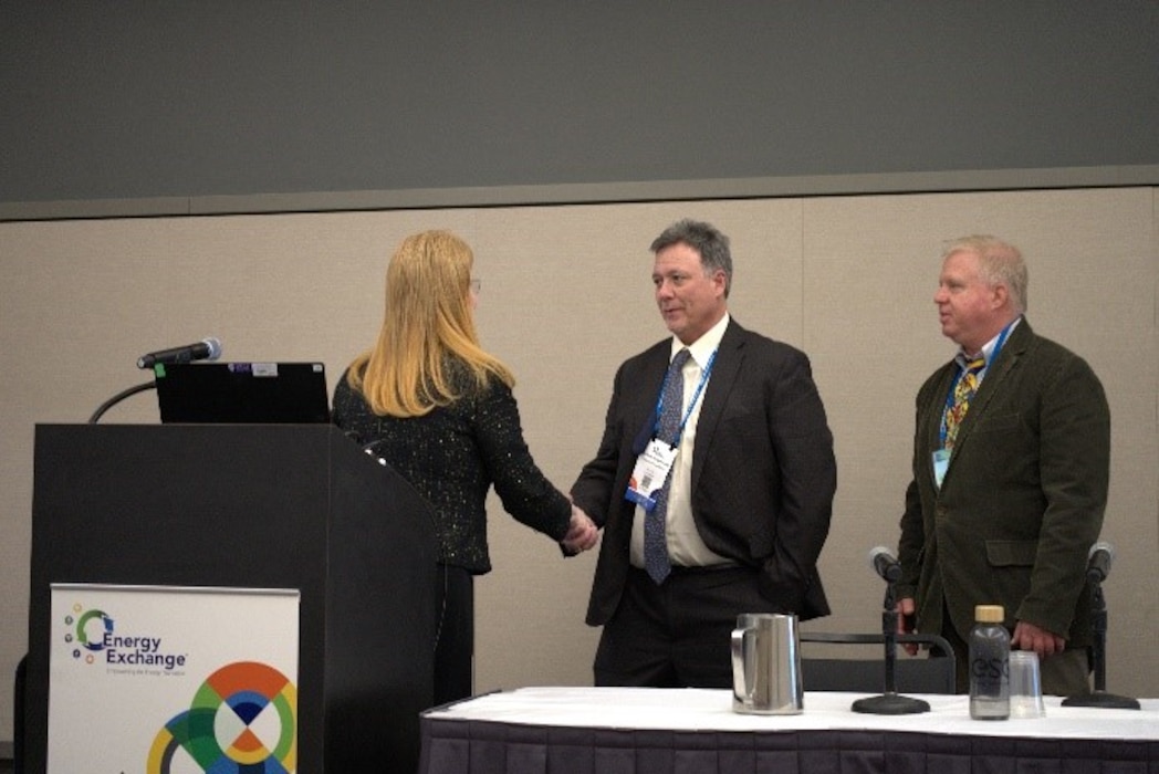 Photo of Mike Ringenburg receiving an FPCC Excellence in Agency Mission Impact Award