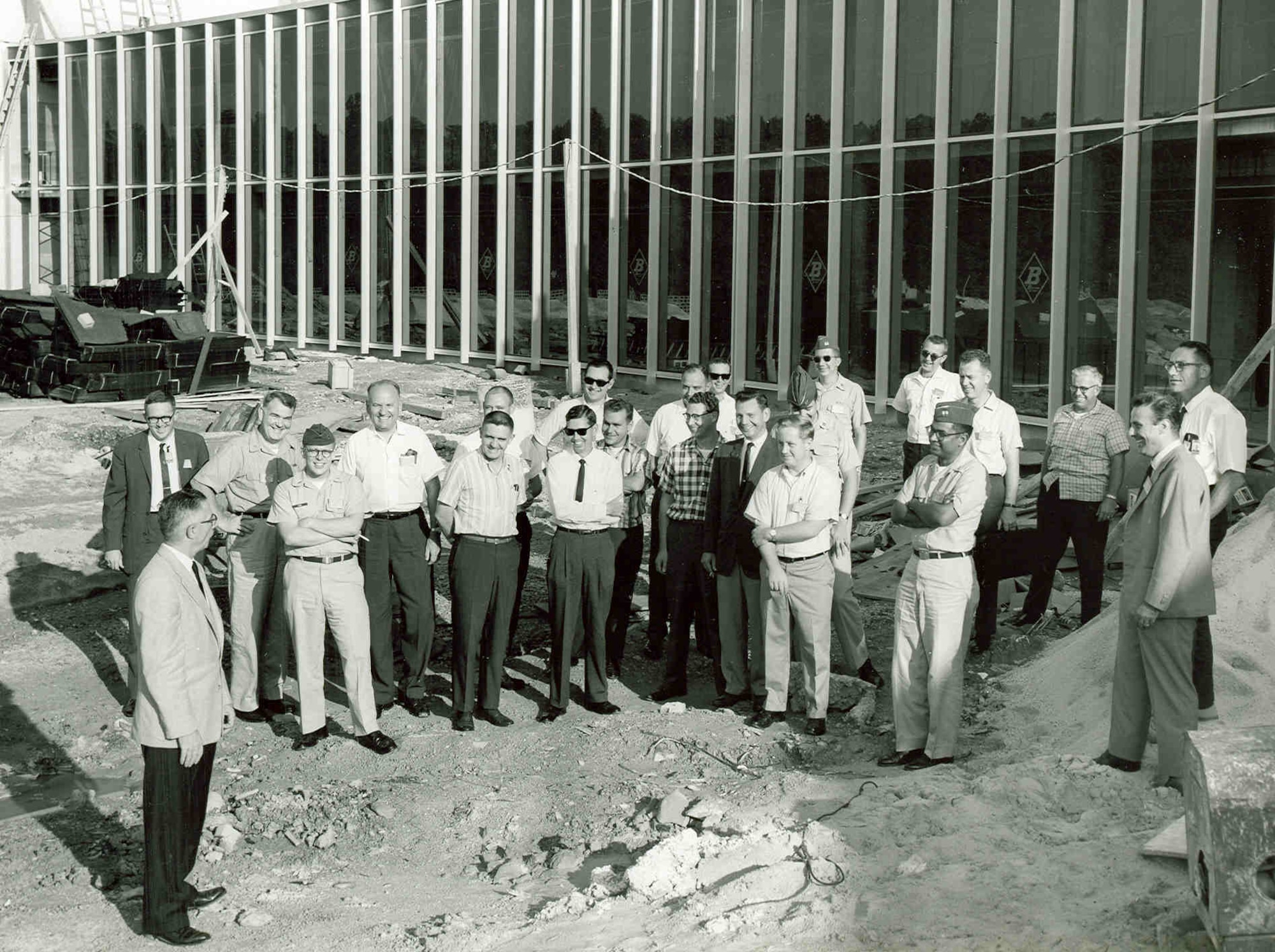 Air Force Systems Command scientists and engineers attending a University of Tennessee Space Institute course being taught at Arnold Air Force Base, Tenn., inspect the then-under construction UTSI in 1965. The first classes were held in the new UTSI building that November, but the first UTSI classes began on Sept. 24, 1964, in offices provided by the Air Force at Arnold AFB, headquarters of Arnold Engineering Development Complex. (U.S. Air Force photo)