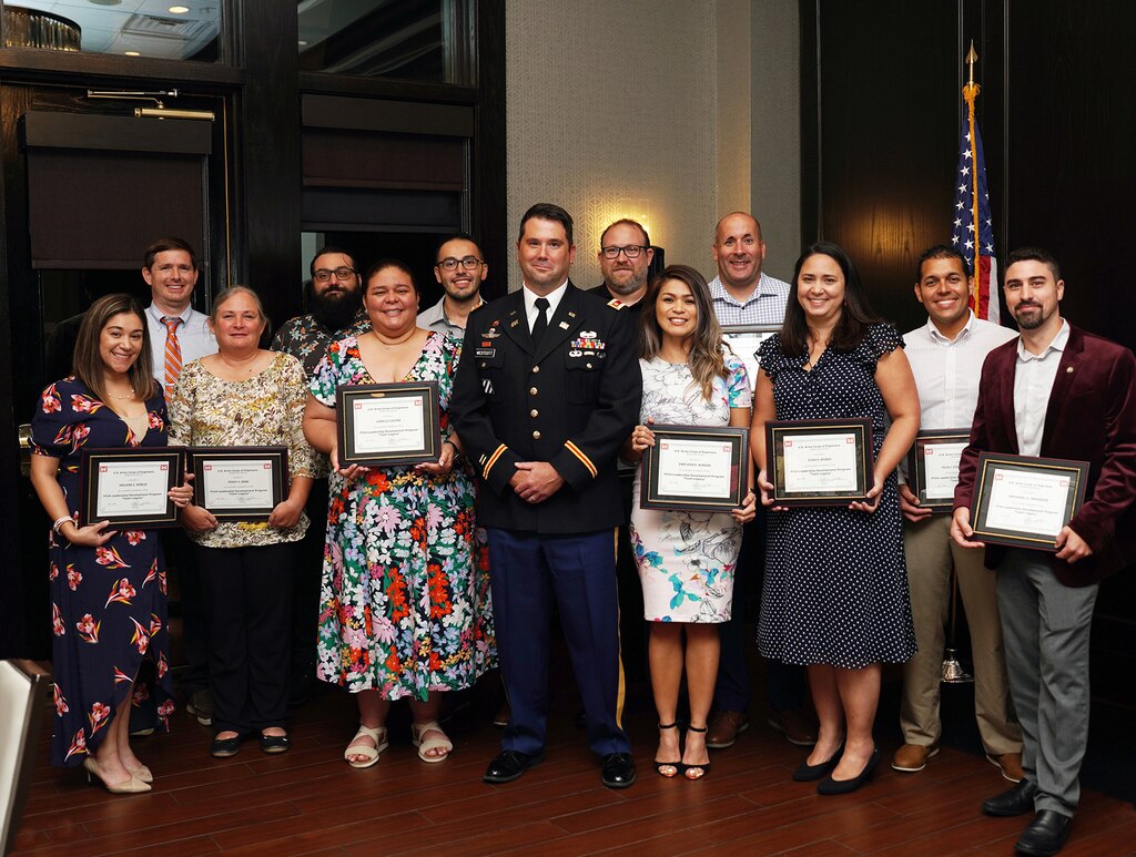 Maj. Matt Westcott Jacksonville District Deputy commander presents the Jacksonville District 2024 Leadership Development Program Class with certificates during a graduation ceremony Sept. 12, 2024, at Maggiano's Little Italy in Jacksonville’s Town Center in Jacksonville, Fla. (USACE Photo by Mark Rankin)