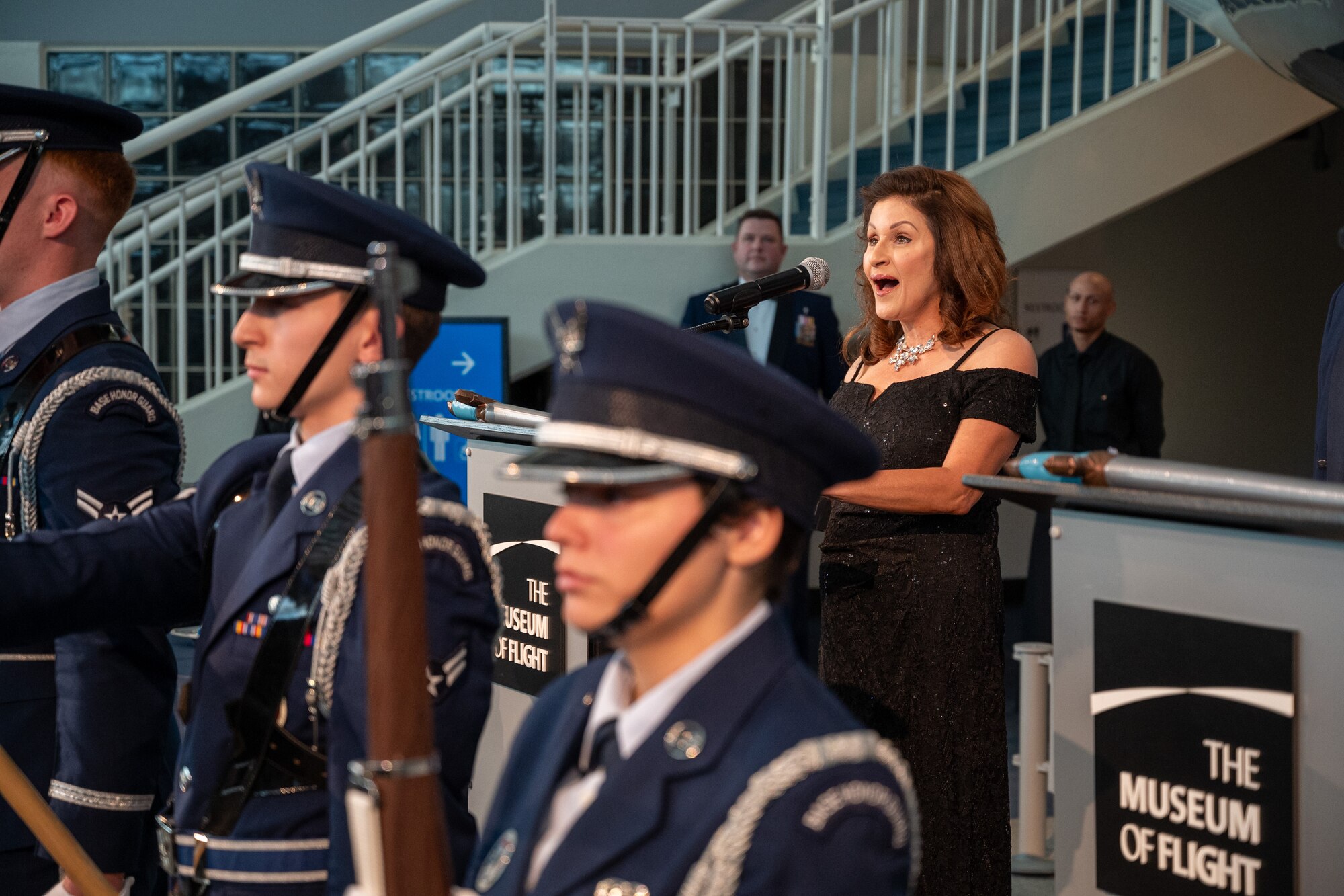 Mrs. Jeannette Holly Diaz sings the National Anthem during the 2024 Team McChord Air Force Ball at the Seattle Museum of Flight in Tukwila, Washington, Sept. 20, 2024.