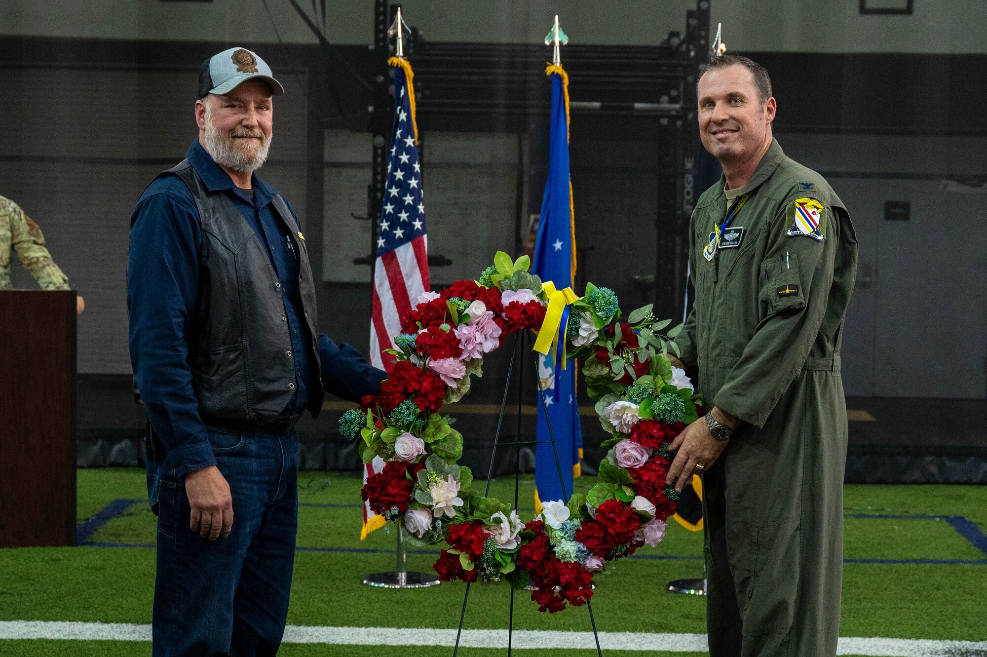 John Zook (left), North Pole American Legion Post 30 commander, and U.S. Air Force Col. Michael Mullin, 354th Fighter Wing deputy commander, present a wreath at the conclusion of the 24 hour POW/MIA run at Eielson Air Force Base, Alaska, Sept. 20, 2024.
