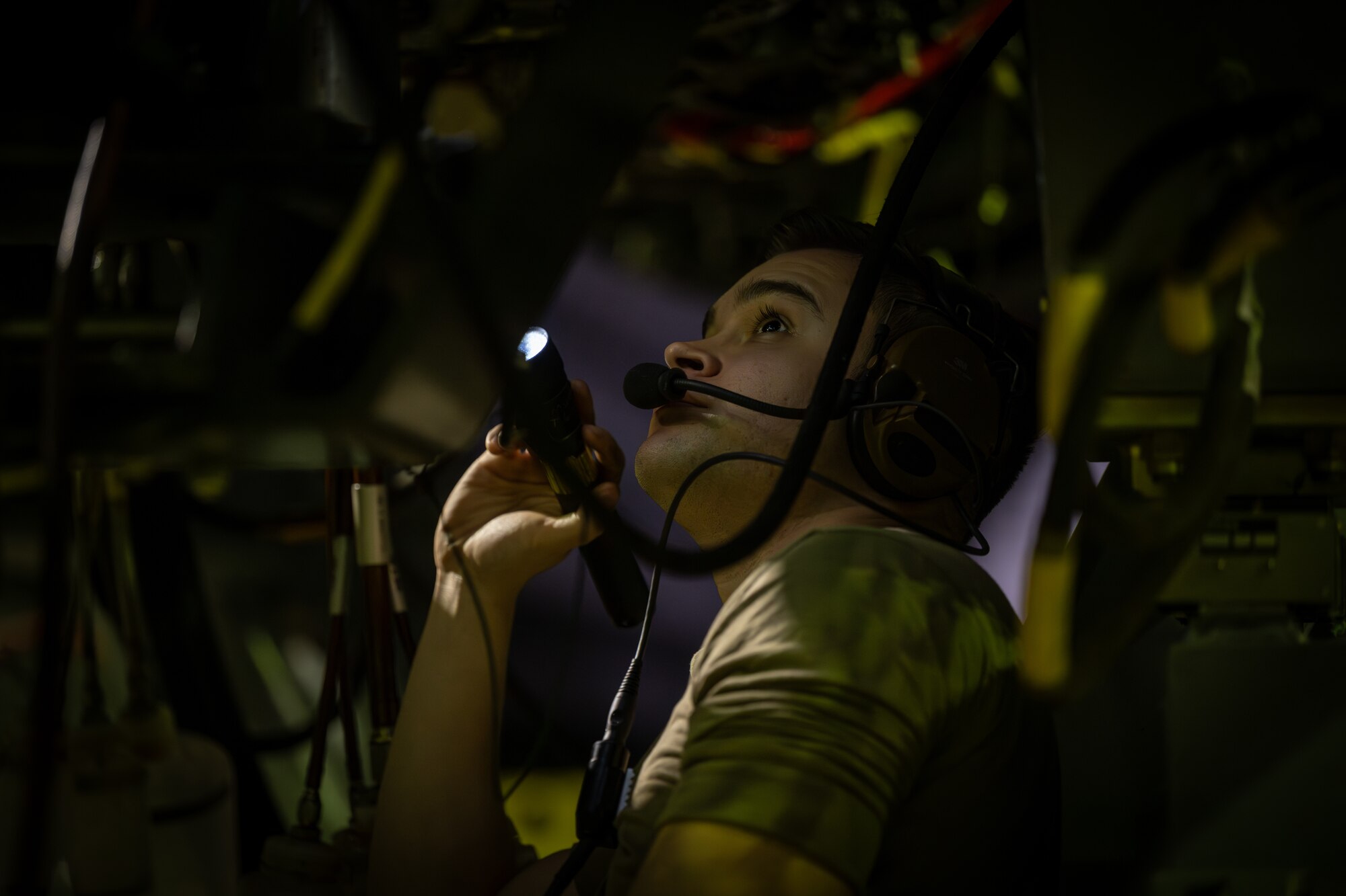 Airman inspects engine
