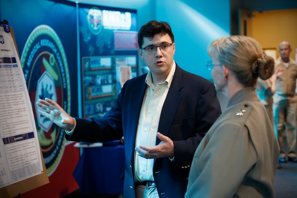 BETHESDA, Md. (Sept. 11, 2024) Rear Adm. Pam Miller, the Medical Officer (TMO) of the Marine Corps, engages with Naval Medical Research Command (NMRC) staff during a Health Services Operational Advisory Group (HSOAG) meeting. Marine Corps Health Services, led by TMO, advises the Commandant and Marines Headquarters staff on all healthcare matters. TMO serves as the functional expert in working with the appropriate Headquarters agencies for determining medical requirements and makes recommendations on all medical matters relevant to supporting the Marine Corps. NMRC is engaged in a broad spectrum of medical research, from basic science in the laboratory to field studies in austere and remote areas of the world to investigations in operational environments. In support of the Navy, Marine Corps and joint U.S. warfighters, NMRC researchers study infectious diseases, biological warfare detection and defense, combat casualty care, environmental health concerns, aerospace and undersea medicine, medical modeling, simulation, operational mission support, epidemiology and behavioral sciences. (U.S. Navy photo by Tommy Lamkin/Released)