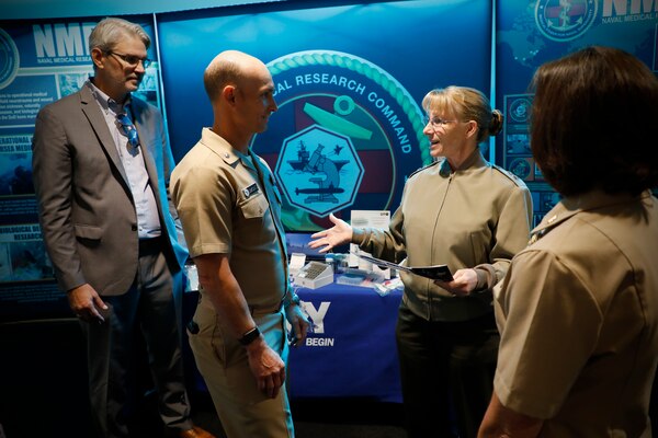 BETHESDA, Md. (Sept. 11, 2024) Rear Adm. Pam Miller, the Medical Officer of the Marine Corps engages with Naval Medical Research Command (NMRC) staff during a Health Services Operational Advisory Group (HSOAG) meeting. Marine Corps Health Services, led by TMO, advises the Commandant and Marines Headquarters staff on all healthcare matters. TMO serves as the functional expert in working with the appropriate Headquarters agencies for determining medical requirements and makes recommendations on all medical matters relevant to supporting the Marine Corps. NMRC is engaged in a broad spectrum of medical research, from basic science in the laboratory to field studies in austere and remote areas of the world to investigations in operational environments. In support of the Navy, Marine Corps and joint U.S. warfighters, NMRC researchers study infectious diseases, biological warfare detection and defense, combat casualty care, environmental health concerns, aerospace and undersea medicine, medical modeling, simulation, operational mission support, epidemiology and behavioral sciences. (U.S. Navy photo by Tommy Lamkin/Released)