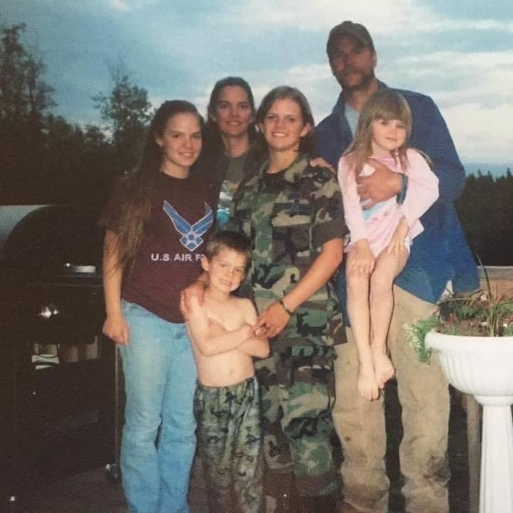 Amn Davis with her family after basic training graduation