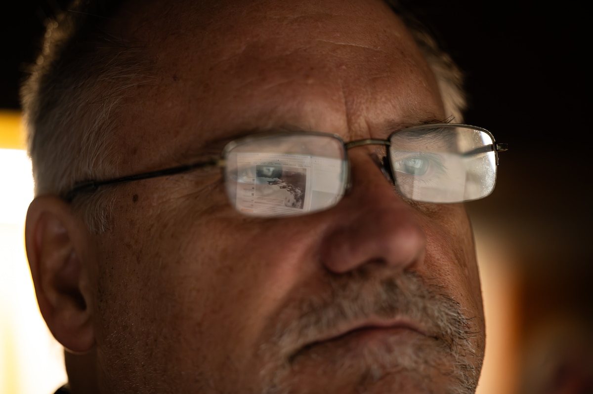 Peter Coffman, 325th Fighter Wing historian, looks over the information he put on a website