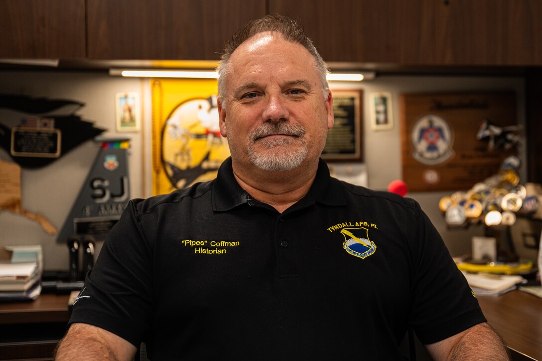 Peter Coffman, 325th Fighter Wing historian, poses for a photo at Tyndall Air Force Base