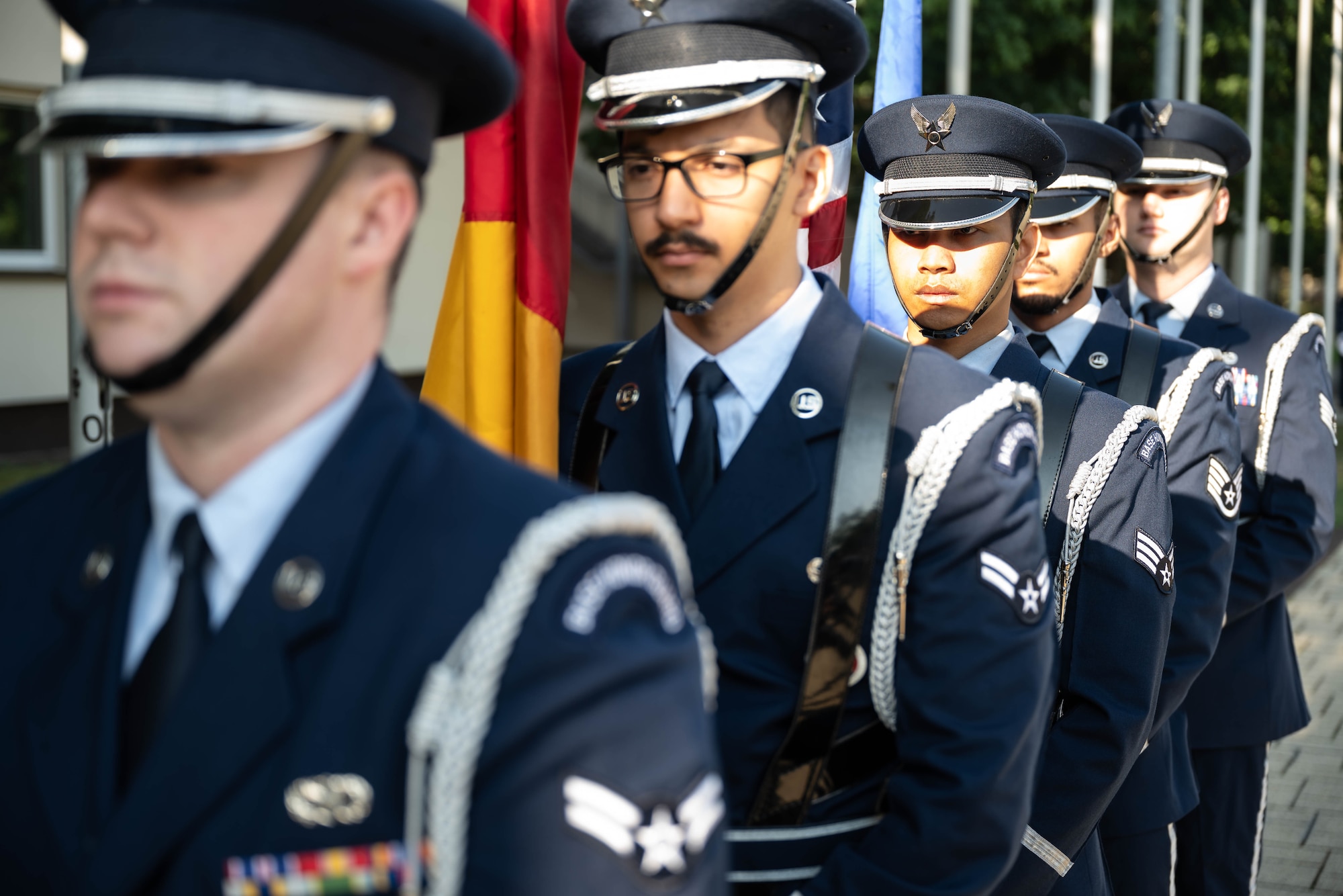 U.S. Air Force Ramstein Air Base Honor Guard members wait for the opening ceremony to begin during the Airman Leadership School renaming ceremony at Kapaun Air Station, Germany, Sept. 19, 2024. The Airman Leadership School was renamed in honor of Retired U.S. Air Force Chief Master Sergeant of the Air Force #18, Kaleth O. Wright, recognizing his impact as an educator and leader of the enlisted force. (U.S. Air Force Photo by Senior Airman Jared Lovett)