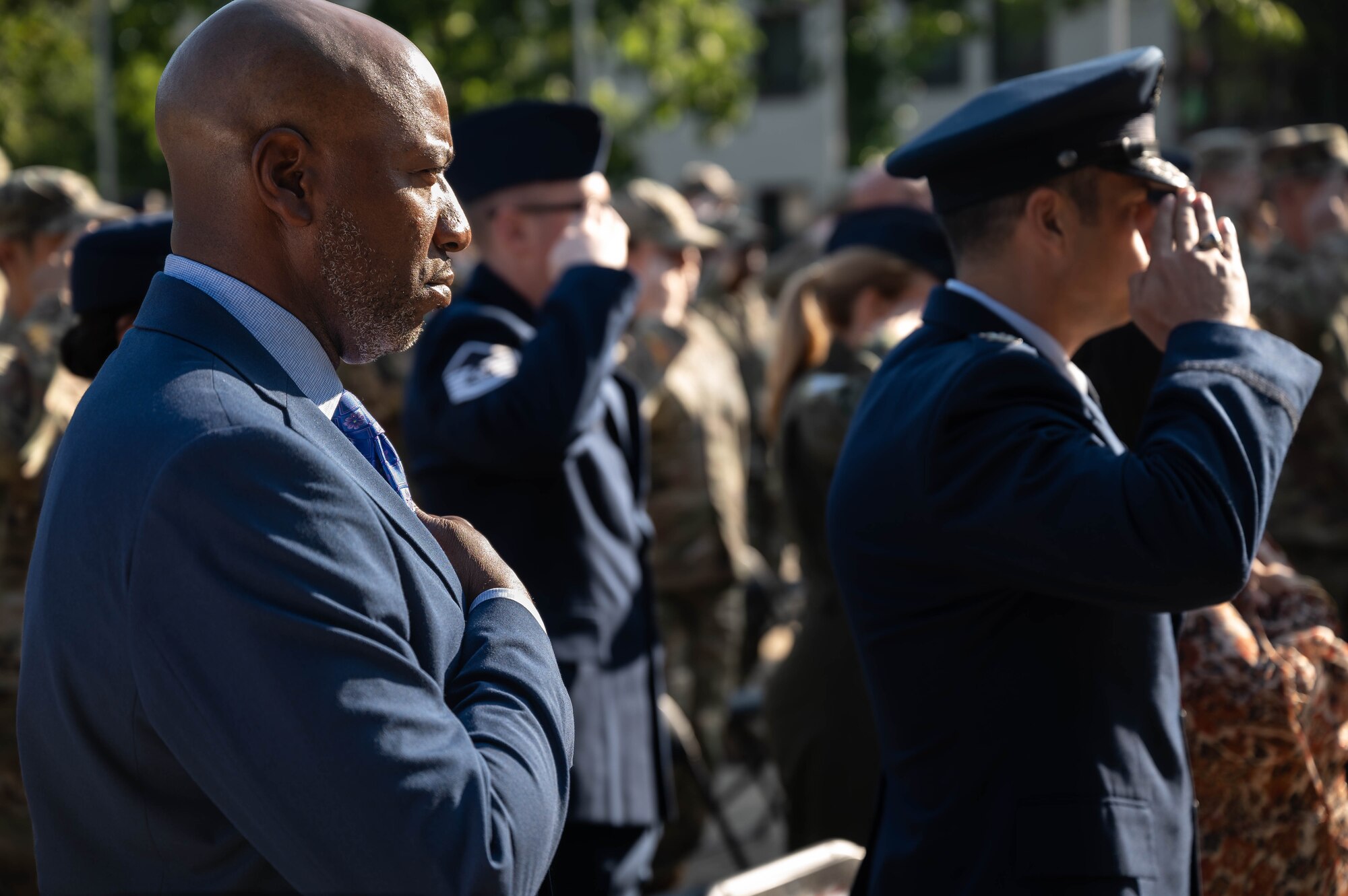 Retired U.S. Air Force Chief Master Sergeant of the Air Force #18, Kaleth O. Wright, places his right hand over his heart during the singing of the U.S. national anthem during the Airman Leadership School renaming ceremony at Kapaun Air Station, Germany, Sept. 19, 2024. The Airman Leadership School was renamed in honor of Wright, who served there as an instructor. (U.S. Air Force Photo by Senior Airman Jared Lovett)