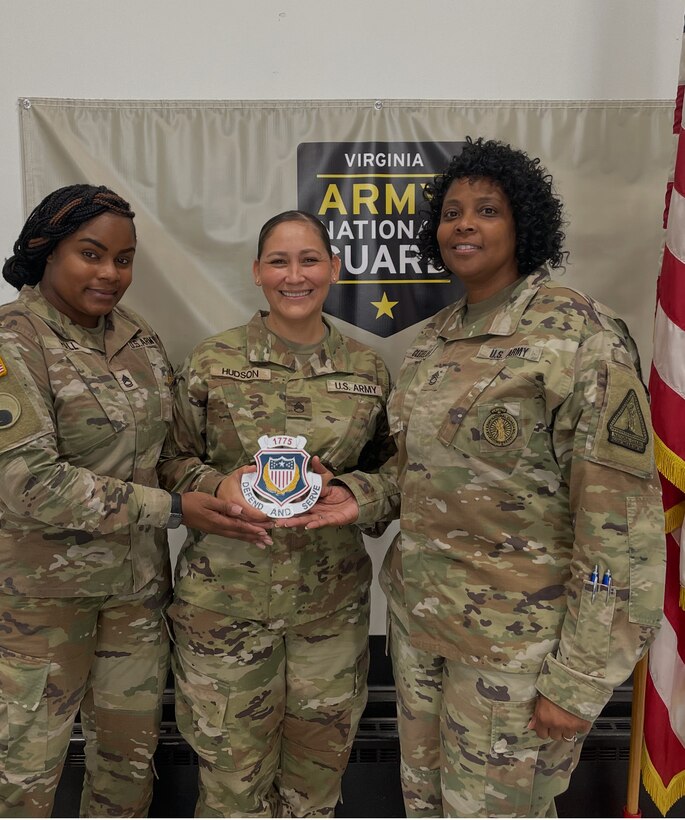 Staff Sgt. Diana Hudson, center, poses with her mentors, Sgt. 1st Class LaTesse Hall, left, and Sgt. 1st Class Gertha Cleveland, right.