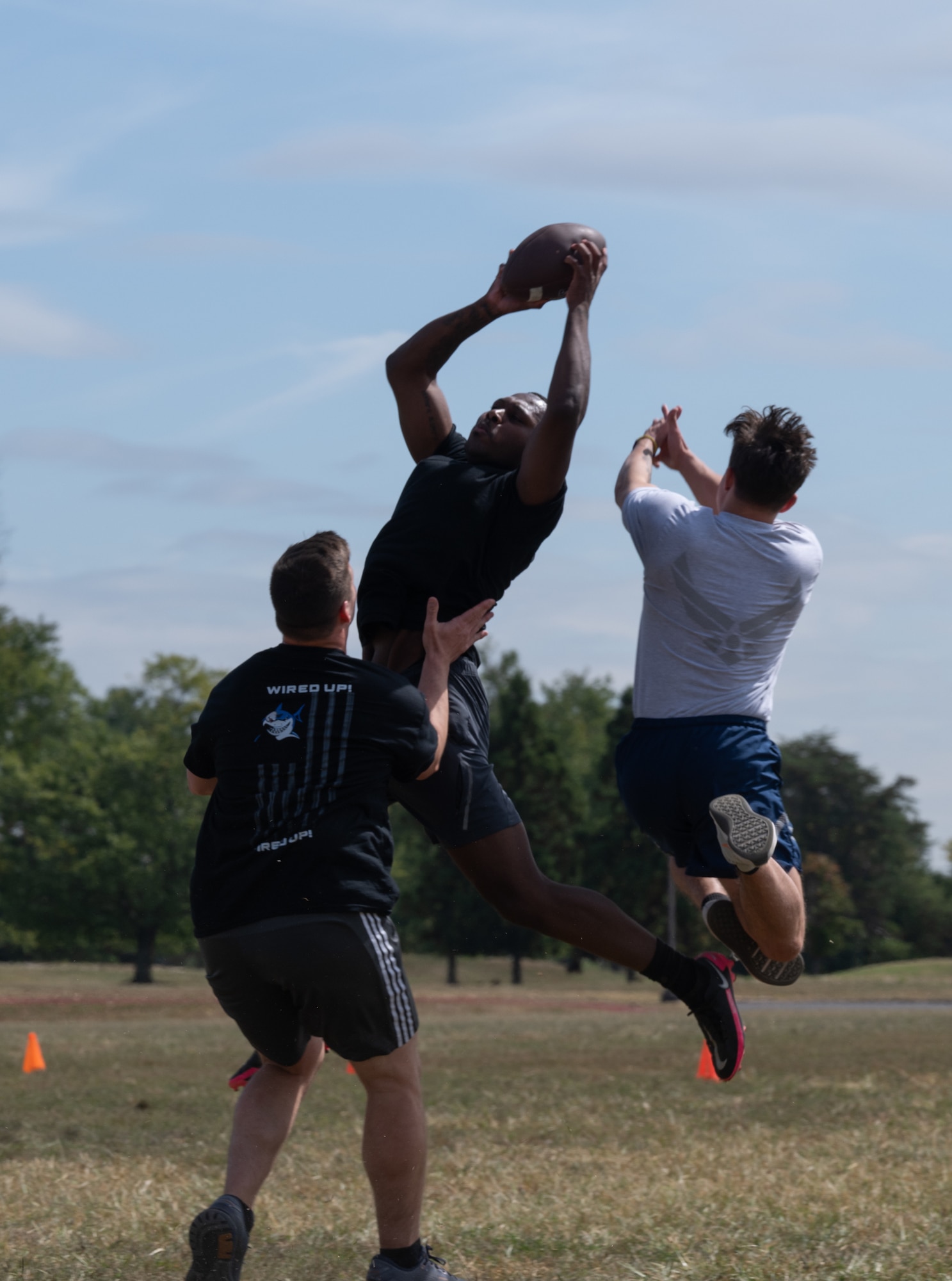 Members assigned to Joint Base McGuire-Dix-Lakehurst, N.J., play flag football during a You Matter Day event at JB MDL, N.J., Sept. 19, 2024. The day kicked off with opening remarks from U.S. Army Col. Bryan Dunker, U.S. Army Support Activity commander, followed by a screening of the documentary, “PTSD: The Walking Wounded,” and field activities. (U.S. Air Force photo by Senior Airman Aidan Thompson)