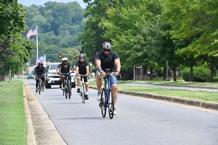 Members of the District of Columbia National Guard’s Combined Support Maintenance Shop set off on their weekly 10–25-mile bike ride from Joint Base Anacostia-Bolling, Aug. 16, 2024. The rides, which promote physical fitness, mental well-being, and team cohesion, take participants through the D.C. area and help maintain mission readiness.