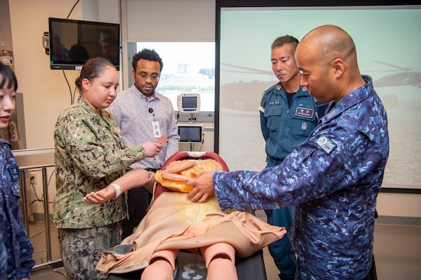 Naval Medical Center Portsmouth (NMCP) staff hosted medical personnel from ships that are part of the Japanese Training Squadron’s Overseas Training Cruise, Sept. 23. An orientation tour and briefs at various locations in the medical center were given to the Japanese medical sailors and officers from the Japanese Maritime Self-Defense Force (JMSDF) JS Kashima and JS Shimakaze. The group visited the medical center’s Healthcare Simulation and Bioskills Training Center (SIM Center), the Emergency Department, Surgical suites, and received briefs on telemedicine.