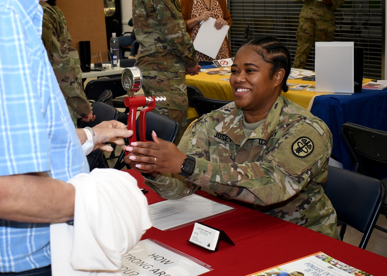 Sgt. Ashtin C. Josey, an occupational therapy specialist with the U.S. Army Medical Department Activity – Fort Drum, tests a military retiree’s grip strength during the Fort Drum Retiree Appreciation Day at Fort Drum, N.Y., Sept. 21, 2024.