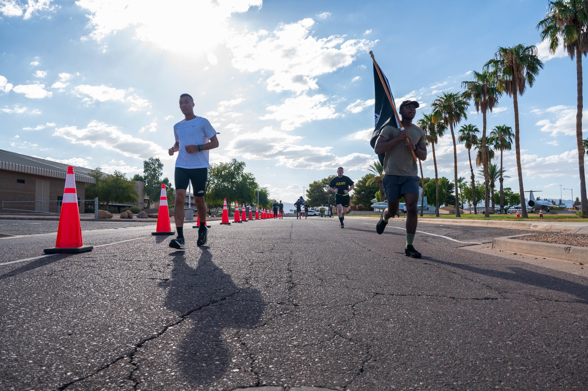 U.S. Air Force Airmen assigned to the 56th Fighter Wing and U.S. Army Soldiers assigned to the Phoenix Army Reserve Center participate in the 24-hour POW/MIA run, Sept. 19, 2024, at Luke Air Force Base, Arizona.