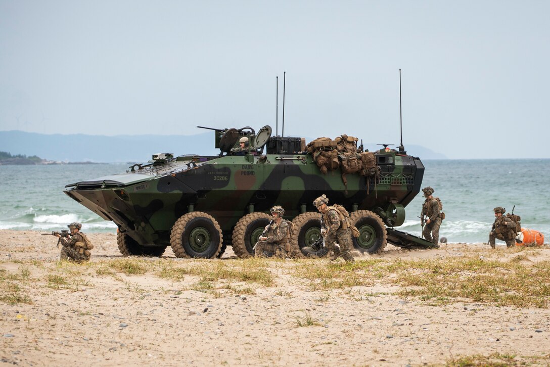 U.S. Marines assigned to Alpha Company, Battalion Landing Team 1/5, 15th Marine Expeditionary Unit, egress an Amphibious Combat Vehicle to secure the beach at Hwajin-ri, South Korea, Sept. 2, 2024, during a simulated amphibious assault as part of exercise Ssang Yong 24. Exercise SY24 strengthens the Republic of Korea-U.S. Alliance through bilateral, joint training, contributing toward combined amphibious capability in defense of the Korean Peninsula. (U.S. Marine Corps photo by Cpl. Amelia Kang)