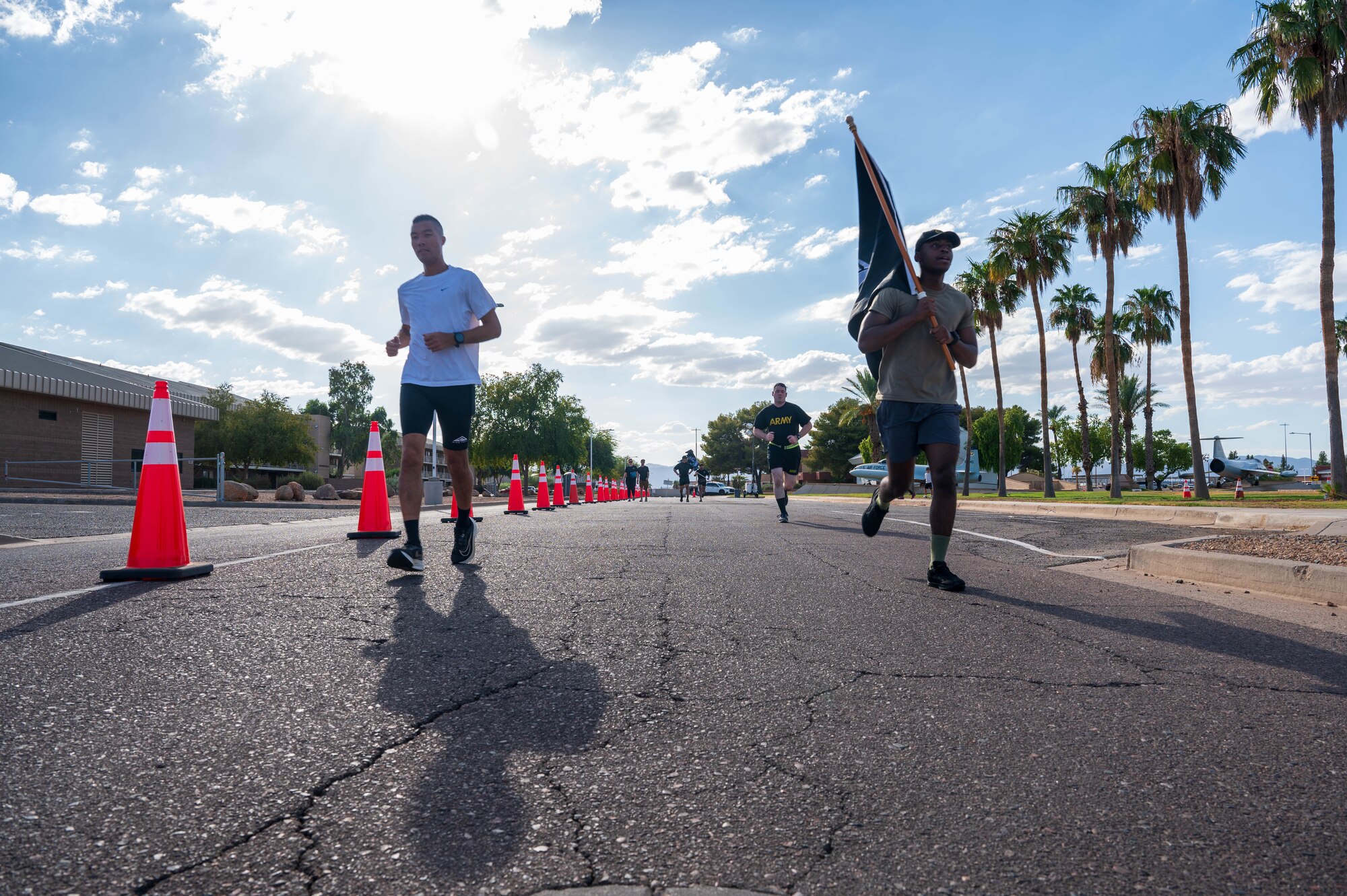 U.S. Air Force Airmen assigned to the 56th Fighter Wing and U.S. Army Soldiers assigned to the Phoenix Army Reserve Center participate in the 24-hour POW/MIA run, Sept. 19, 2024, at Luke Air Force Base, Arizona.