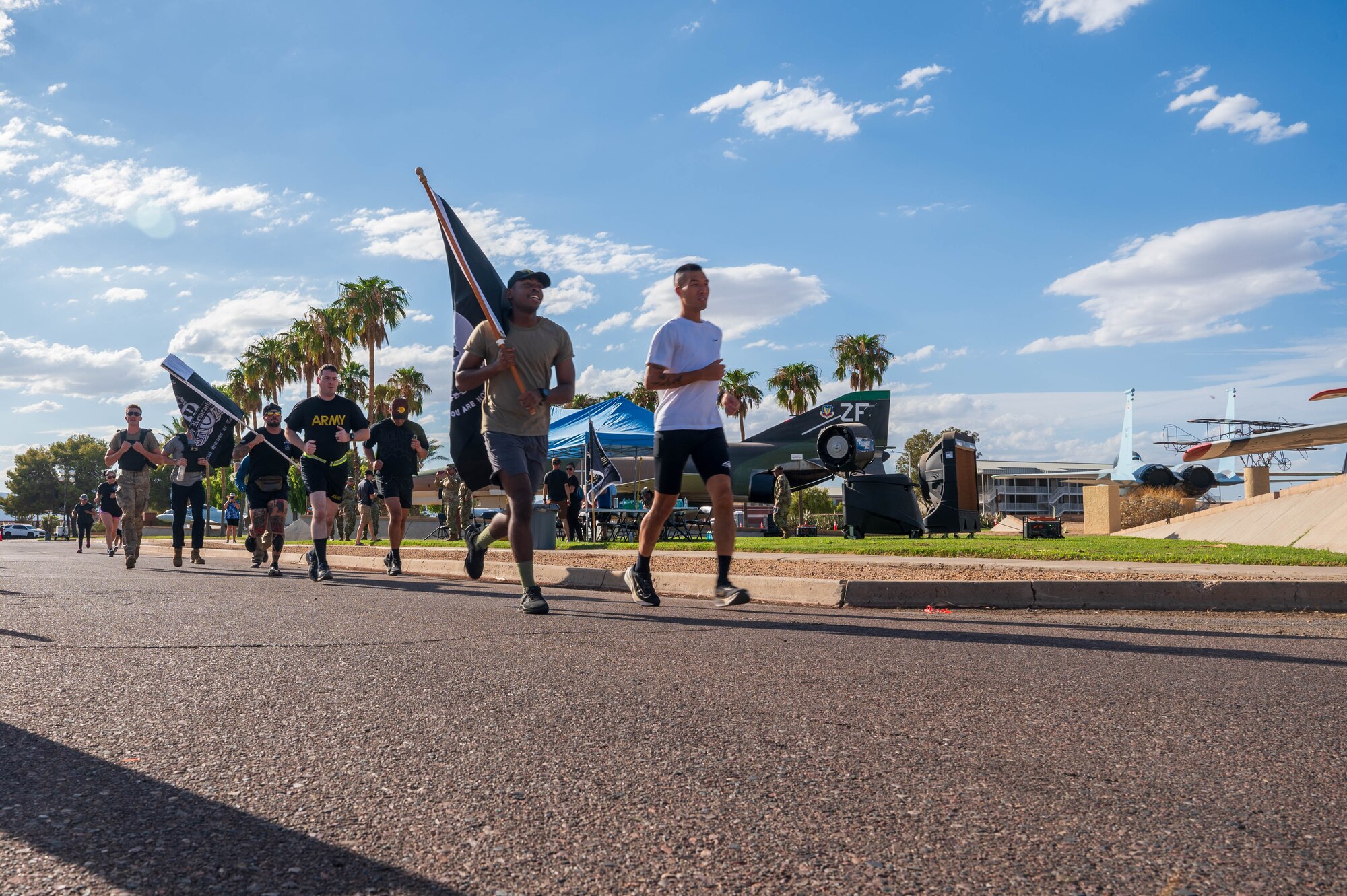U.S. Air Force Airmen assigned to the 56th Fighter Wing and U.S. Army Soldiers assigned to the Phoenix Army Reserve Center participate in the 24-hour POW/MIA run, Sept. 19, 2024, at Luke Air Force Base, Arizona.