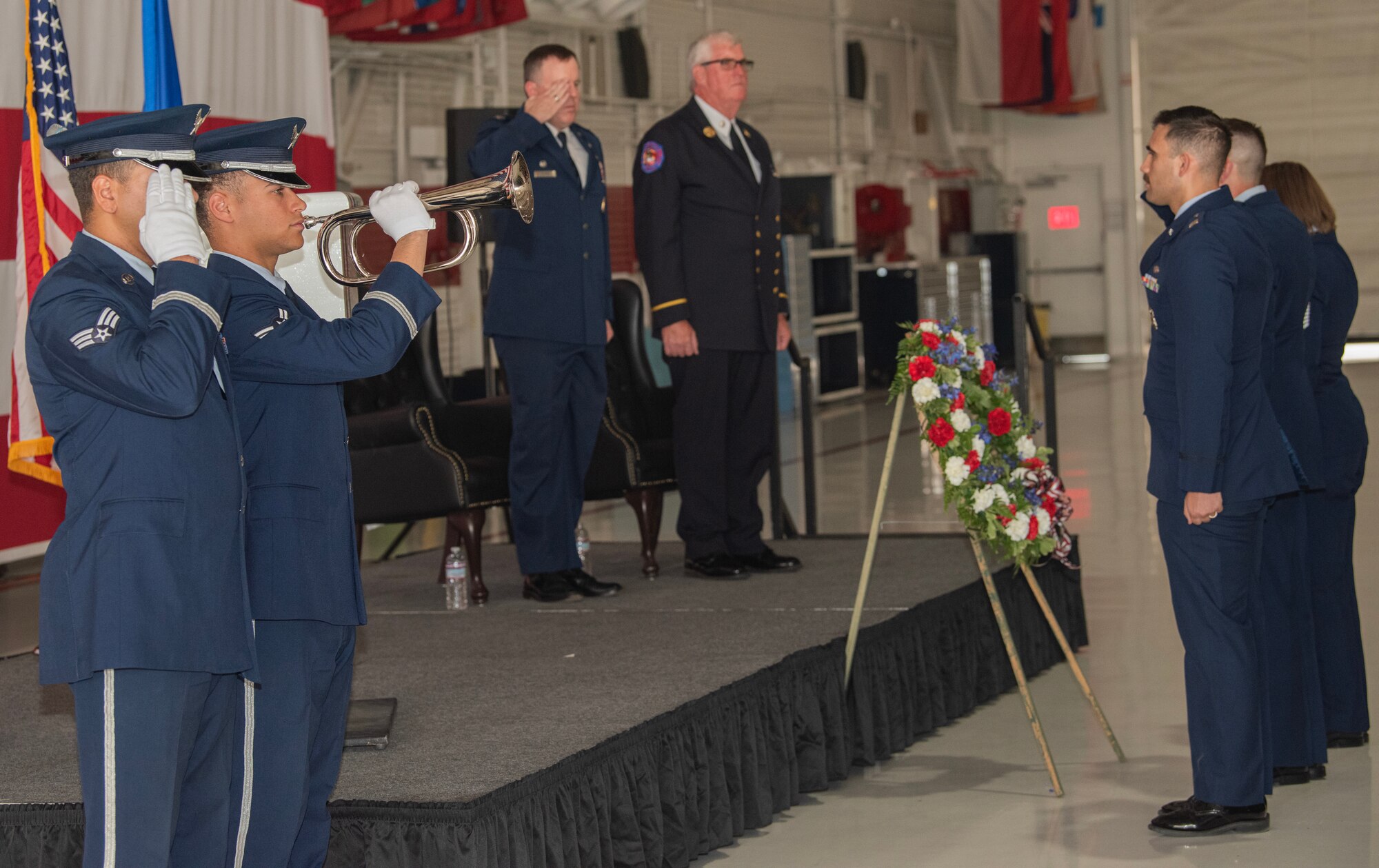 U.S. Airmen, first responders and guests participate in a 9/11 ceremony