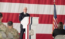 Man delivers speech in front of crowd