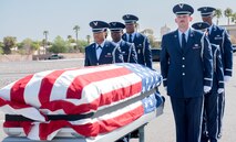 Airmen prepare the casket during a full funeral honors demonstration