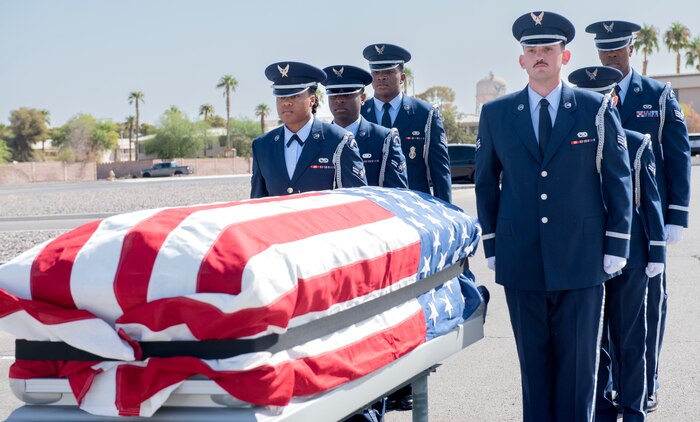 Airmen prepare the casket during a full funeral honors demonstration