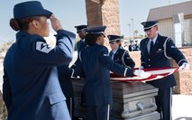 Airmen render a salute during an Honor Guard funeral honors demonstration