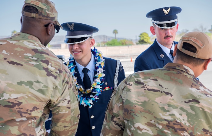 Honor Guard graduates shake hands with crowd