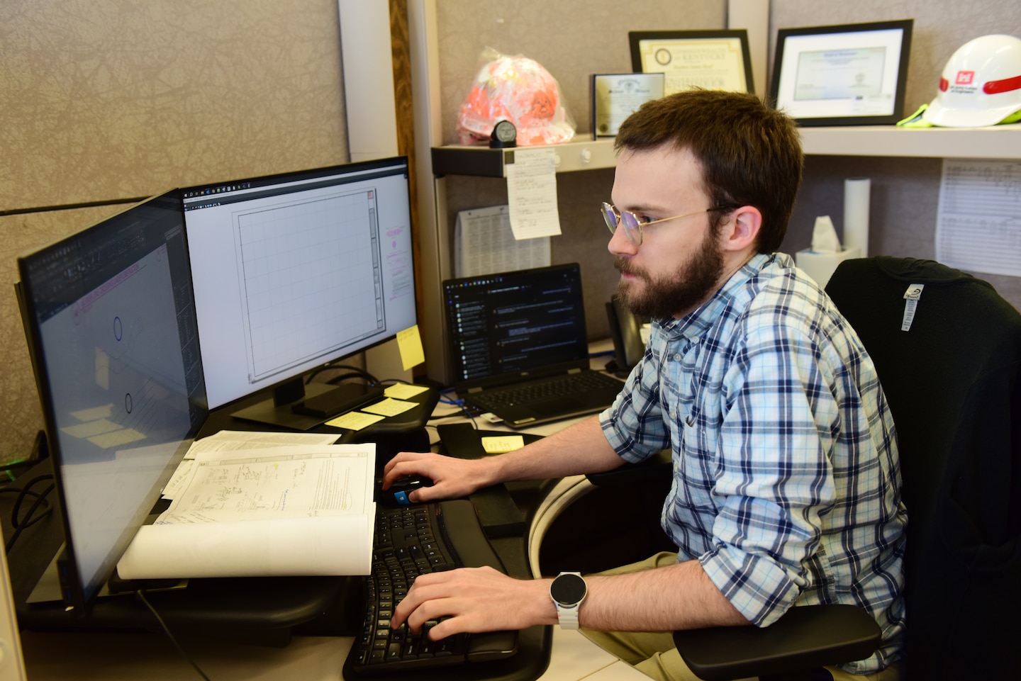 Civil Engineer Stephen Reed, U.S. Army Corps of Engineers Nashville District, works at his desk Sept. 23, 2024, at Nashville District Headquarters in Nashville, Tennessee. Reed is the district’s employee of the month for June 2024. (USACE Photo by Lee Roberts)