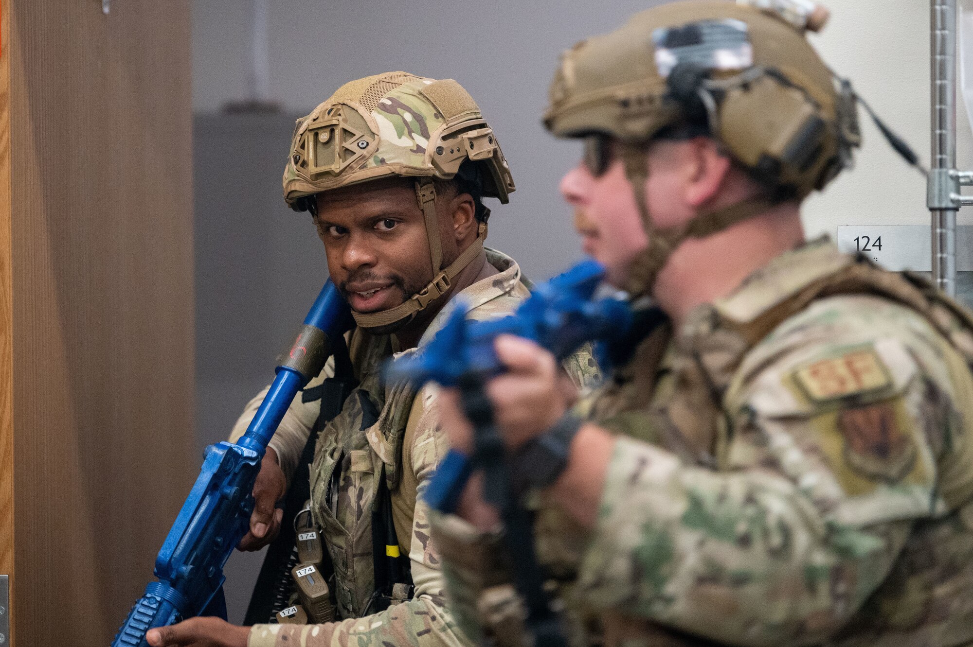 Security Forces Squadron specialist investigators, inspect a room during an exercise