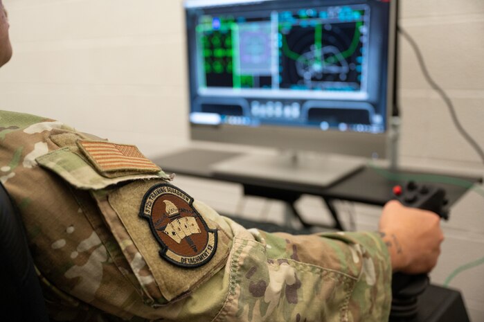 An Airman in an F-35 aircraft maintenance ground