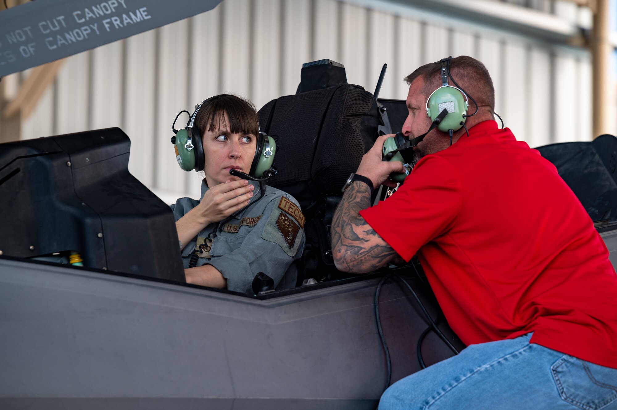 Two people talking in an F-35