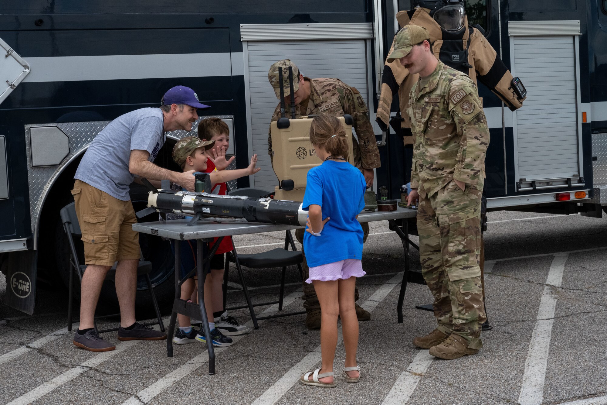 Family Mobility Line attendees tour the explosive ordnance disposal display Sept. 21, at McConnell Air Force Base, Kansas. The EOD demonstration was part of the event for service member’s families to experience and understand the deployment process. (U.S. Air Force photo by Airman 1st Class Paula Arce)