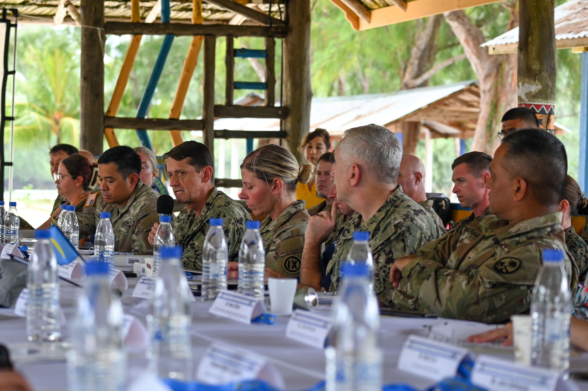 U.S. Navy Rear Adm. Gregory Huffman, commander, Joint Task Force-Micronesia, speaks at the 2024 Mid-Joint Committee Meeting at the Peleliu South Dock, Republic of Palau, Sept. 16, 2024. The JCM is a biannual, bilateral meeting to discuss action items involving the security, protection, and improvement of the infrastructure, economy, and people of Palau. (U.S. Air Force photo by Airman 1st Class Natasha Ninete).