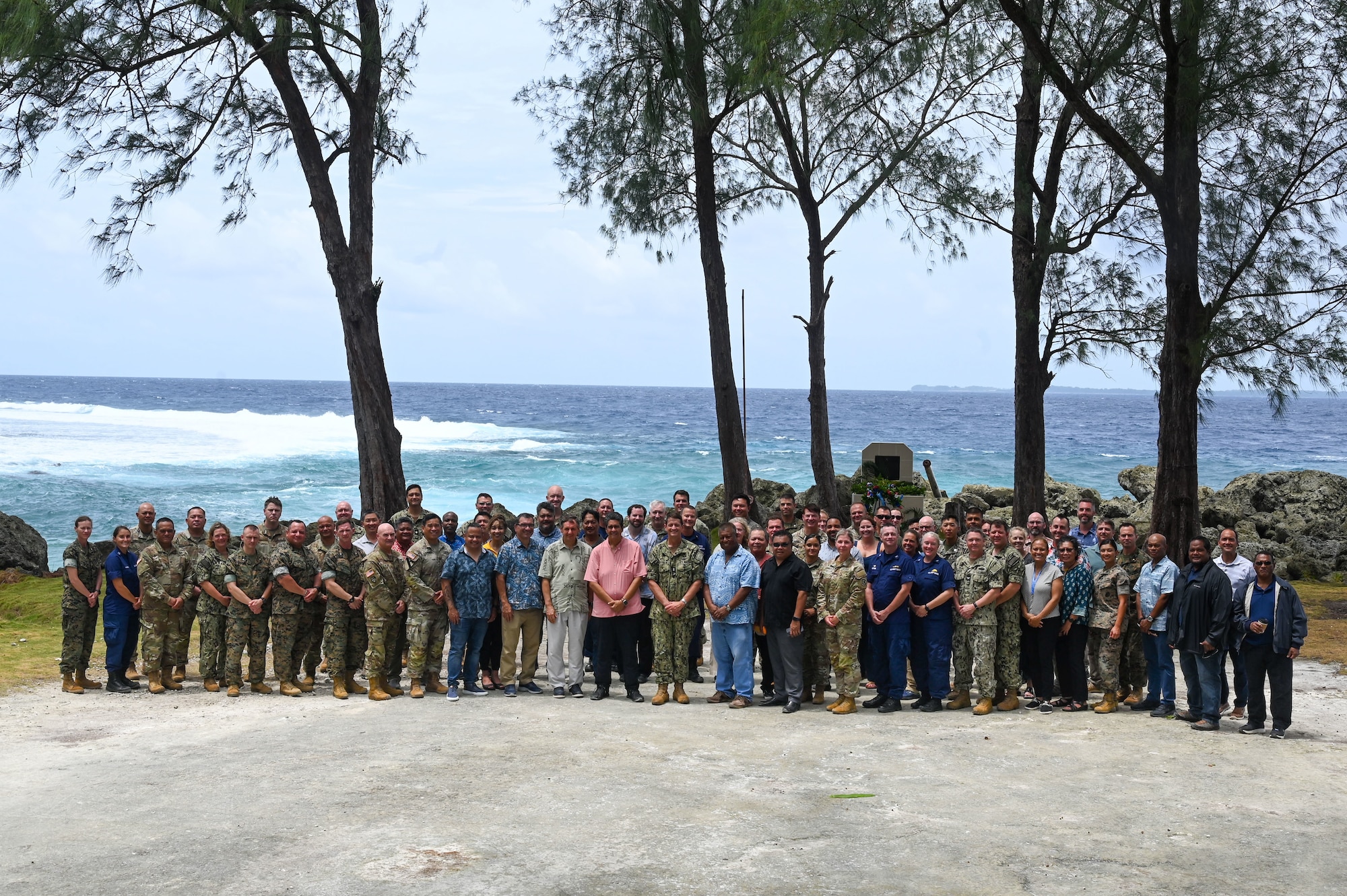 Members of the 2024 Mid-Joint Committee Meeting (JCM) pose for a group photo at the Peleliu South Dock, Republic of Palau, on Sept. 16, 2024. The JCM is a biannual, balateral meeting to discuss action items involving the security, protection, and improvement of the infrastructure, economy, and people of Palau. (U.S. Air Force photo by Airman 1st Class Natasha Ninete).