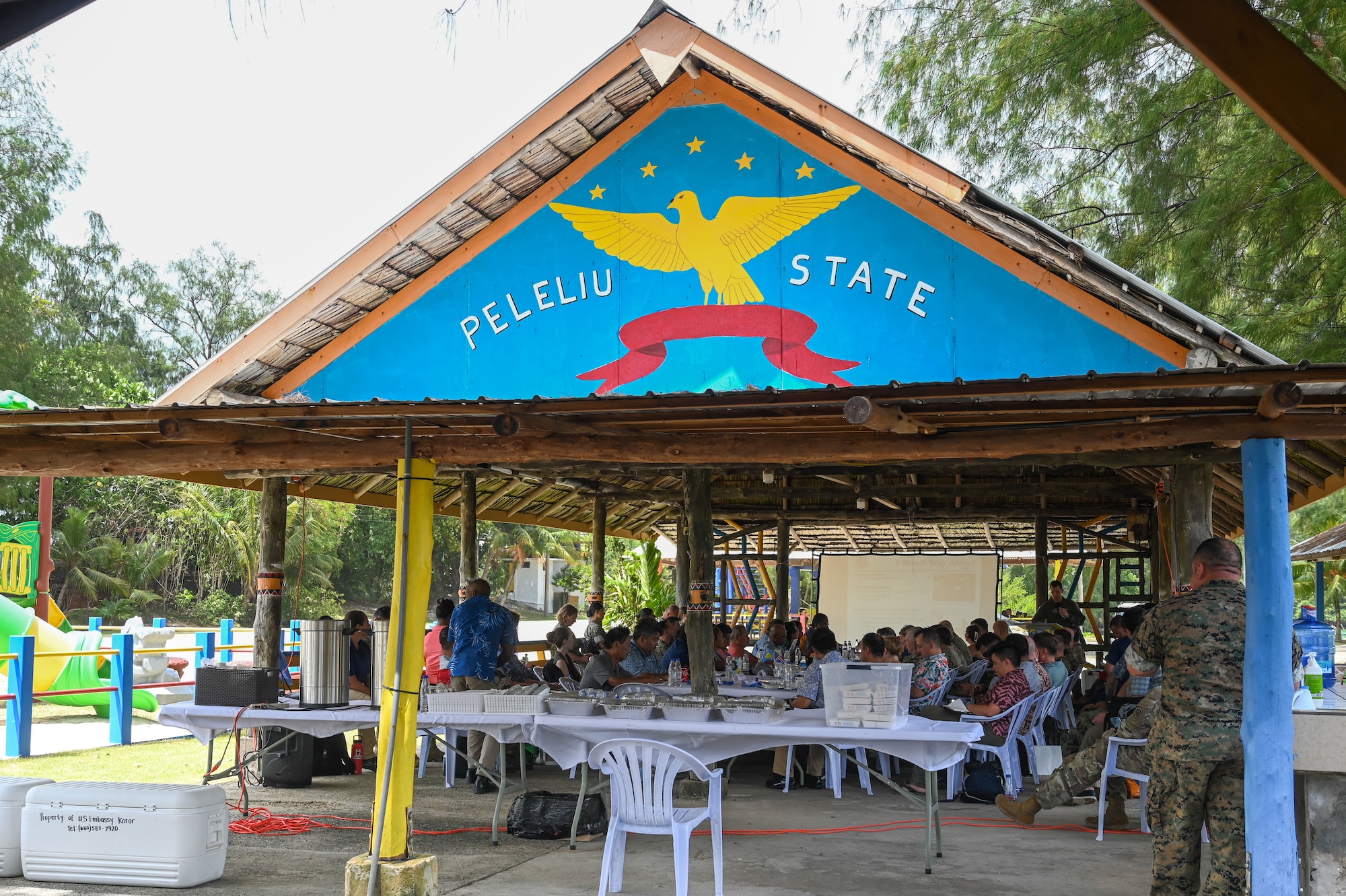 The United States-Republic of Palau Mid-Joint Committee Meeting (JCM) members conduct Day 1 of JCM discussions at the Peleliu South Dock, Republic of Palau, Sept. 16-17, 2024. The JCM is a biannual, bilateral meeting between U.S. and Palau senior officials to plan and accomplish action items related to the security, economy, and environment of Palau, amongst others. (U.S. Air Force photo by Airman 1st Class Natasha Ninete).