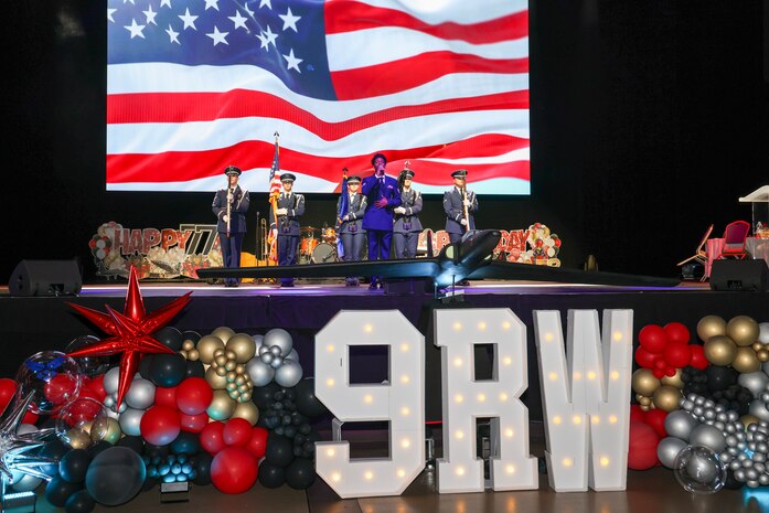 U.S. Air Force Staff Sgt. Clarence Bennett, 9th Maintenance Squadron non-destructive inspection journeyman, performs the national anthem while the Beale Air Force Base Honor Guard presents the colors, during the Beale Air Force Ball 2024 commemorating the 77th birthday of the U.S. Air Force at Wheatland, California, September 12, 2024.