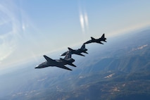 U.S. Air Force 1st Reconnaissance Squadron T-38 Talons perform a missing-man formation flyover of Beale Air Force Base, California Sept. 11, 2024