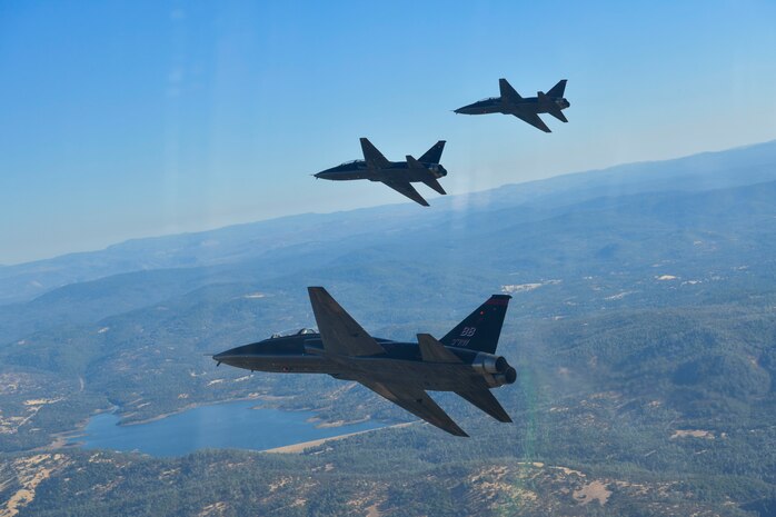 U.S. Air Force 1st Reconnaissance Squadron T-38 Talons perform a missing-man formation flyover of Beale Air Force Base, California Sept. 11, 2024.