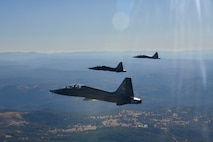 U.S. Air Force 1st Reconnaissance Squadron T-38 Talons perform a missing-man formation flyover of Beale Air Force Base, California Sept. 11, 2024.
