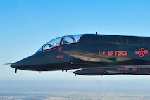 U.S. Air Force 1st Reconnaissance Squadron T-38 Talons perform a missing-man formation flyover of Beale Air Force Base, California Sept. 11, 2024.