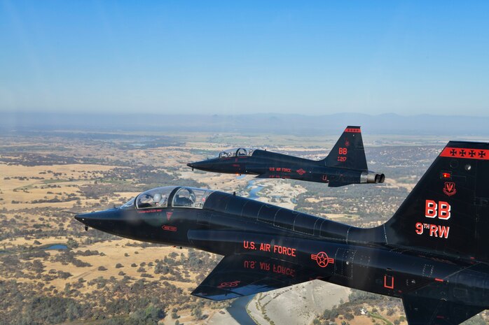 U.S. Air Force 1st Reconnaissance Squadron T-38 Talons perform a missing-man formation flyover of Beale Air Force Base, California Sept. 11, 2024.
