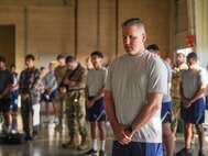 U.S. Air Force Master Sgt. Shawn Houser, 9th Medical Group first sergeant, participates in a moment of silence during a 9/11 Remembrance Event  at Beale Air Force Base, California, Sept. 11, 2024.