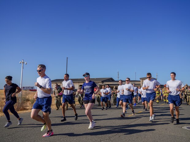 Airmen from the 9th Reconnaissance Wing begin their 9/11 remembrance run near Station 1 at Beale Air Force Base, California, Sept. 11, 2024