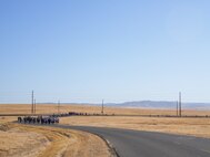Airmen from the 9th Reconnaissance Wing begin their 9/11 remembrance run near Station 1 at Beale Air Force Base, California, Sept. 11, 2024.