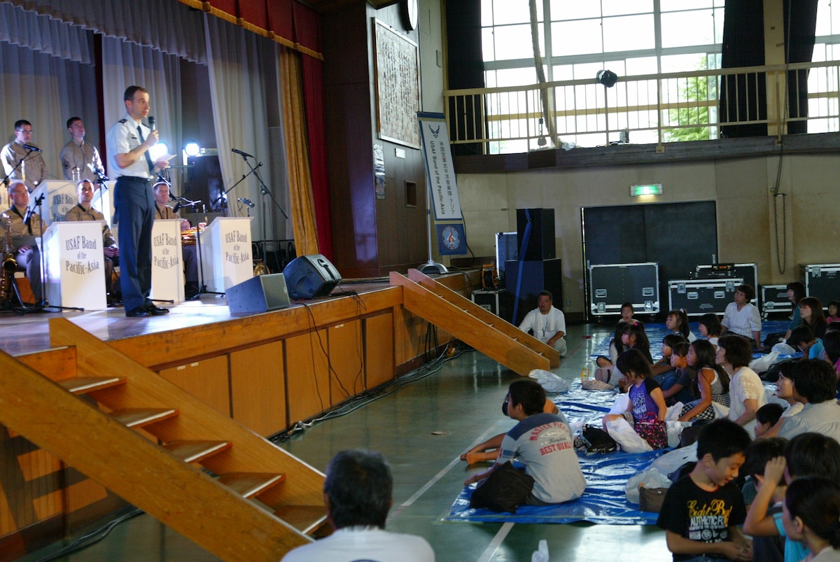 The U.S. Air Force Band of the Pacific-Asia performs for residents of Kabanomachi, a coastal town near Sendai city, Japan, in the Kabanomachi Elementary School gymnasium, on Sept. 3, 2011. The band traveled and played at Kabanomachi Elementary in the aftermath of a tsunami that struck the eastern coast of Japan on March 11, 2011, causing 19,759 deaths and severe damage. The U.S. Department of Defense mounted a massive humanitarian relief mission known as “Operation Tomodachi”, with the USAF flying 225 missions to deliver 4.2 million pounds of cargo and approximately 2,800 people within the first two weeks after the disaster, providing essential aid and support to Japanese partners and neighbors. (U.S. Air Force photo by SrA Erica Ashley Huseby)
