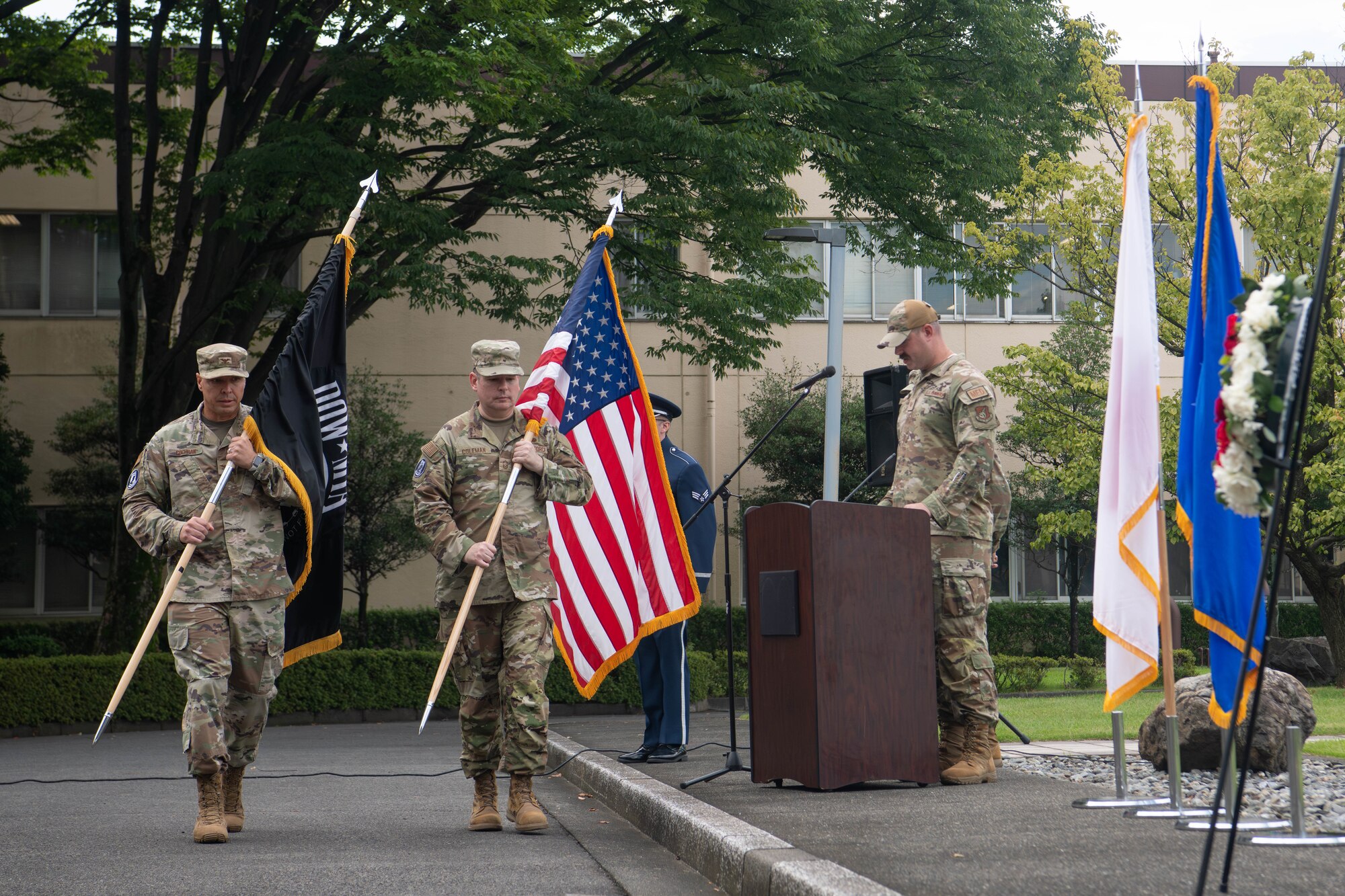 From left, U.S. Air Force Col. Brett Cochran, 374th Airlift Wing deputy commander, and Chief Master Sgt. Paul Coleman, 374th Communications Squadron senior enlisted leader, complete the 24-hour POW/MIA vigil run.