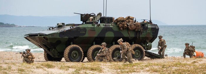 U.S. Marines assigned to Alpha Company, Battalion Landing Team 1/5, 15th Marine Expeditionary Unit, egress an Amphibious Combat Vehicle to secure the beach at Hwajin-ri, South Korea, Sept. 2, 2024, during a simulated amphibious assault as part of exercise Ssang Yong 24.