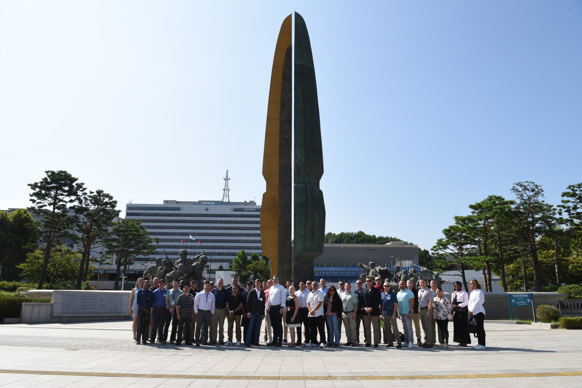 A group of chief master sergeants from Kunsan Air Base, Osan Air Base, Daegu Air Base, and U.S. Army Garrison Humphreys pose in front of the Korean War Monument at the War Memorial of Korea in Seoul, Republic of Korea on September 4, 2024. The tour of the War Memorial of Korea provided the senior leaders with a comprehensive overview of the Korean War, enabling them to better comprehend the current political and military landscape of the region. (U.S. Air Force photo by Master Sgt. Rachelle Coleman)